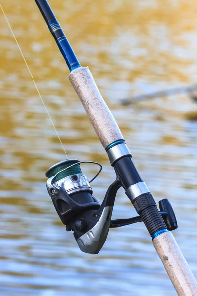 Fishing rods on riverside — Stock Photo, Image