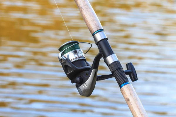 Fishing rods on riverside — Stock Photo, Image