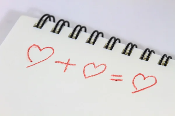 Disegno del cuore su notebook bianco — Foto Stock