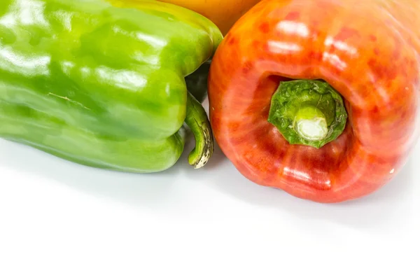 Colored peppers over white background — Stock Photo, Image