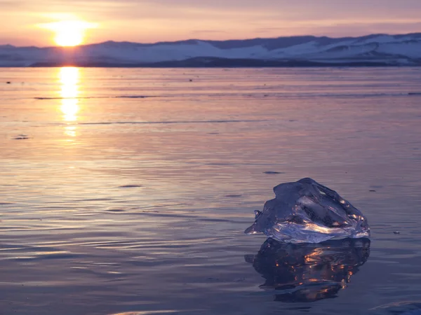 A piece of ice lying on the frozen surface of lake Baikal — Stock Photo, Image