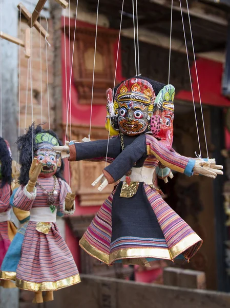 Souvenir puppets hanging in  the street shop in Bhaktapur, Nepal — Stock Photo, Image