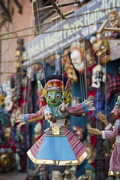 Souvenir puppets hanging in  the street shop in Bhaktapur, Nepal — Stock Photo, Image