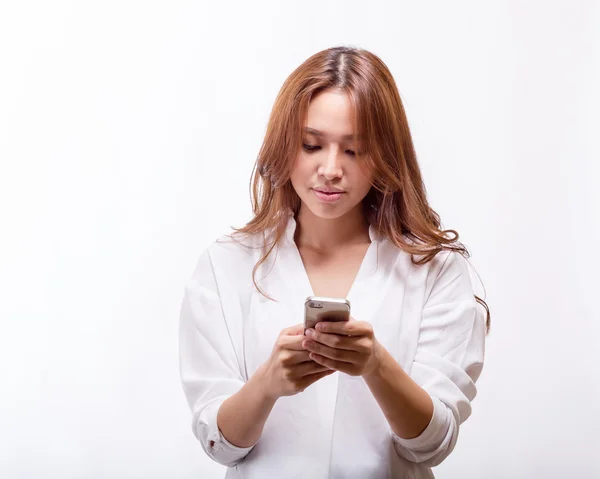 Asian woman with smart phone texting — Stock Photo, Image