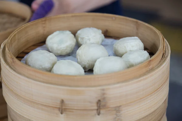 Dumplings in bamboo steamer