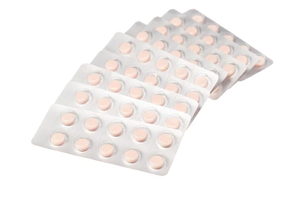 Tabletten in een zeepbel verpakking op witte achtergrond — Stockfoto