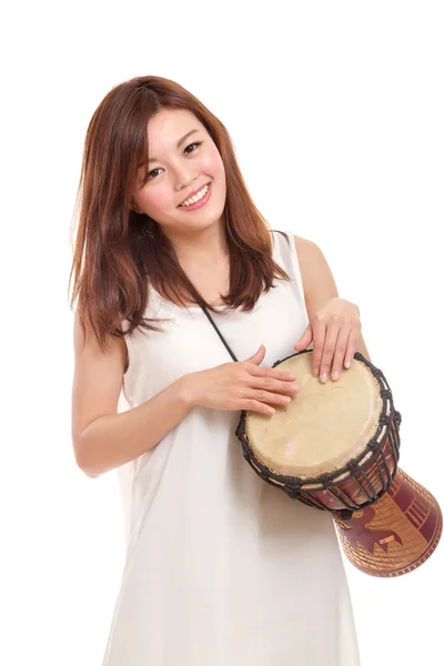 Asian woman playing a djembe — Stock Photo, Image