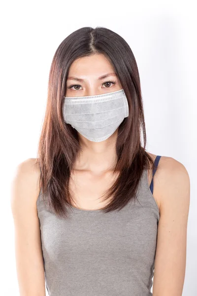 Asian woman wearing a surgical mask — Stock Photo, Image