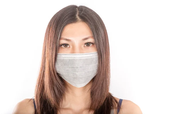 Asian woman wearing a surgical mask — Stock Photo, Image