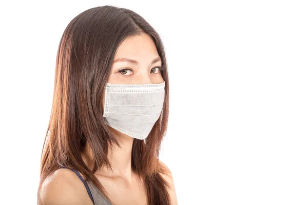 Asian woman wearing a surgical mask — Stock Photo, Image