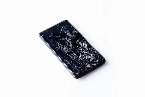 Teléfono móvil con pantalla rota aislada en blanco . — Foto de Stock