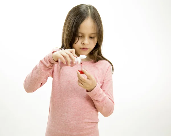 Young girl taking medicine — Stock Photo, Image