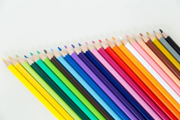 Row of color pencil crayons — Stock Photo, Image