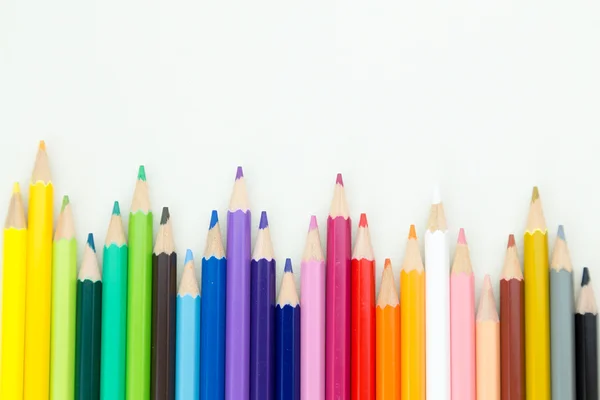 Row of color pencil crayons — Stock Photo, Image