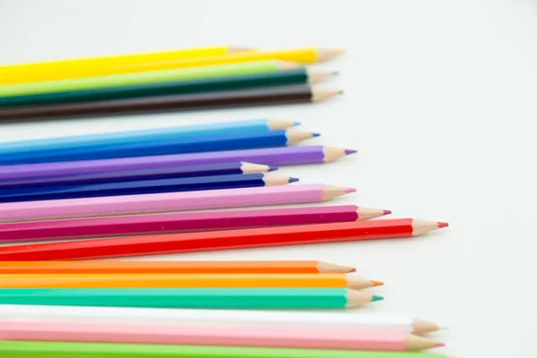 Row of color pencil crayons — Stock Photo, Image