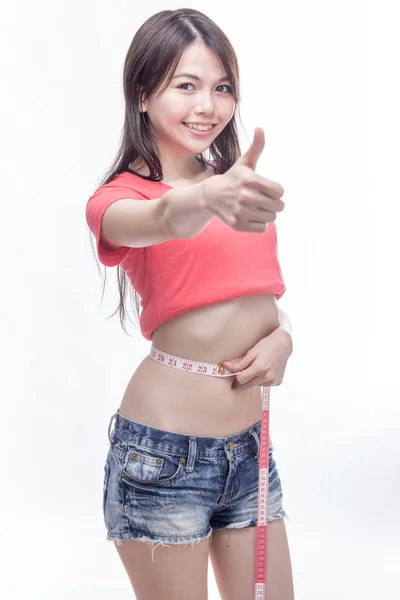 Asian woman measuring waist — Stock Photo, Image