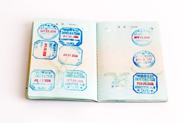 Visas and stamps in passport — Stock Photo, Image