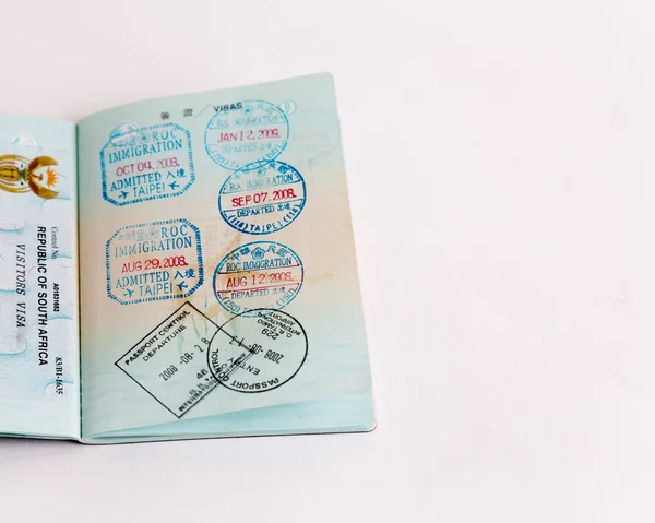 Visas and stamps in passport — Stock Photo, Image