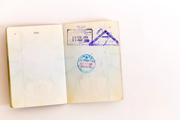 Visas and stamps in passport — Stock Photo, Image