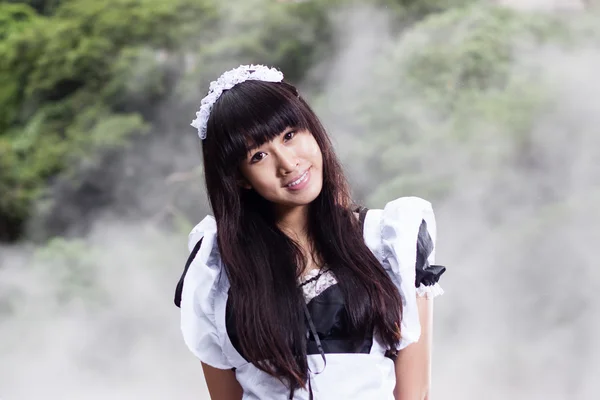 Asian woman in maid outfit — Stock Photo, Image