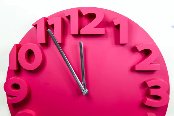 Red clock with five to midnight — Stock Photo, Image