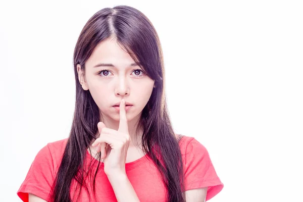 Aziatische vrouw met vinger op lippen — Stockfoto