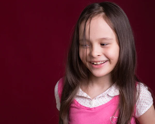 Young Asian American girl on red background — Stock Photo, Image