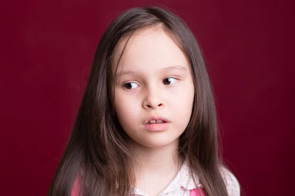 Young Asian American girl on red background — Stock Photo, Image