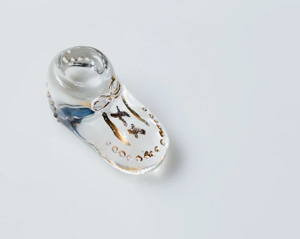 Vintage glass baby shoe — Stock Photo, Image