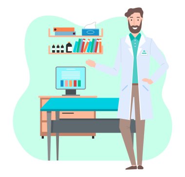 Beyaz önlüklü genç doktor ya da veteriner muayene masasının ve ofisteki bilgisayar ekranının yanında duruyor.