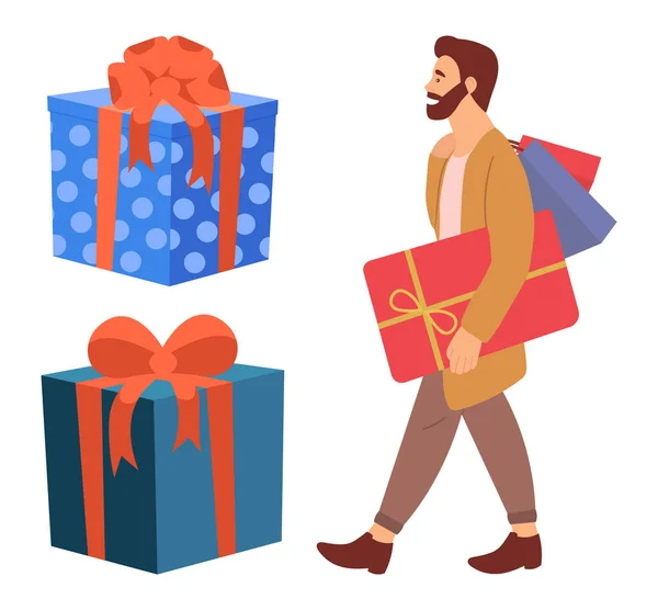 Sérieux homme barbu est debout avec des cadeaux dans ses mains. Jeune acheteur gars près de grandes boîtes-cadeaux — Image vectorielle
