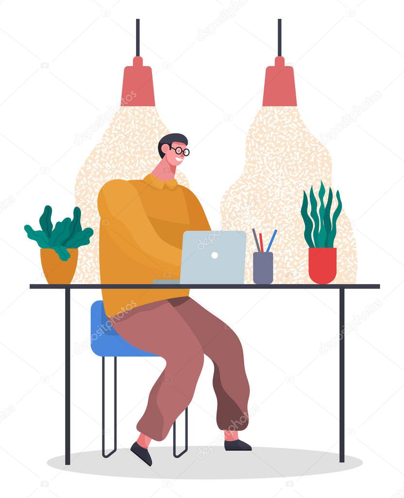 Office worker at the table with a laptop. Businessman or a clerk working at his office workplace
