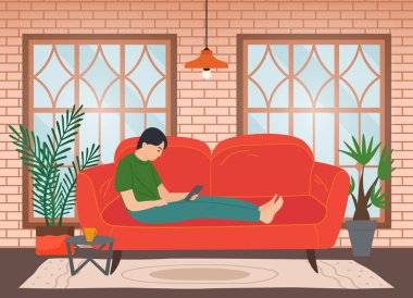 Kanepede oturan adam internette sörf yapıyor. Sosyal medya ağ iletişimi