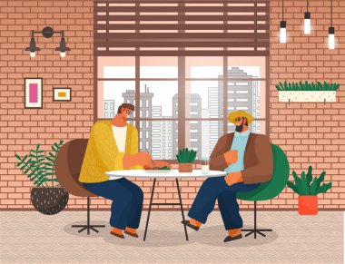 İki erkek arkadaş bir restoranda masada yemek yiyorlar. Erkek karakterler bir kafede yemek yiyorlar.