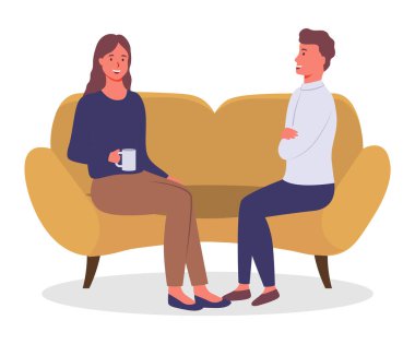 Resmi kıyafetler giymiş iş adamları kanepede birlikte oturuyor, konuşuyor, kahve içiyorlar.