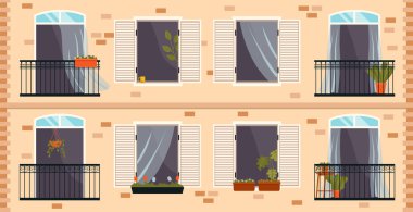 Demir çitli balkon ve açık pencere. Saksı bitkileriyle dolu büyük bir pencere.