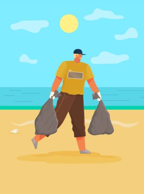 Adam kıyı şeridindeki kağıt atıklarını temizliyor. Adam plajın kirli bölgelerinde çöp topluyor.