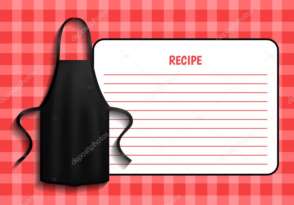 Black apron next to paper with recipe. Clothes for work in kitchen near cooking instructions
