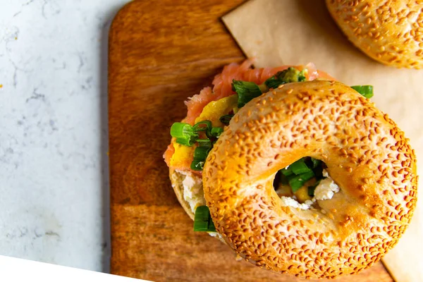 Top View Breakfast Composition Sandwich Made Sesame Bagel Smoked Salmon — Stockfoto