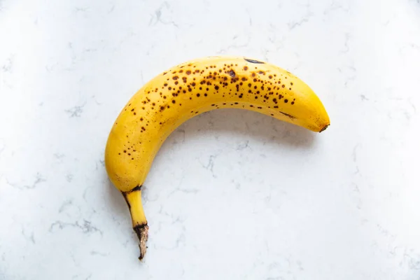 Ripe Overripe Yellow Banana Brown Spots Marble Kitchen Counter — Fotografia de Stock