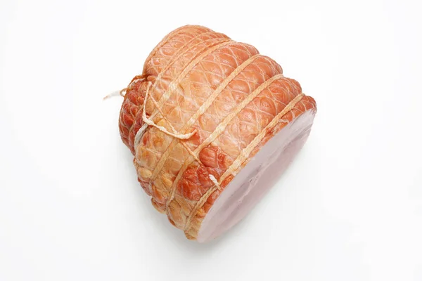 Top view of smoked ham isolated on a white background. Homemade, smoked cold cuts, in netting, cut, with visible cross section. Traditional meat product, a packshot photo for package design, template. — Stock Photo, Image