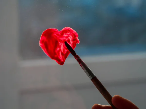 Little Girl Holds Paintbrush Hand Drawing Red Heart Window Glass — Stock Photo, Image