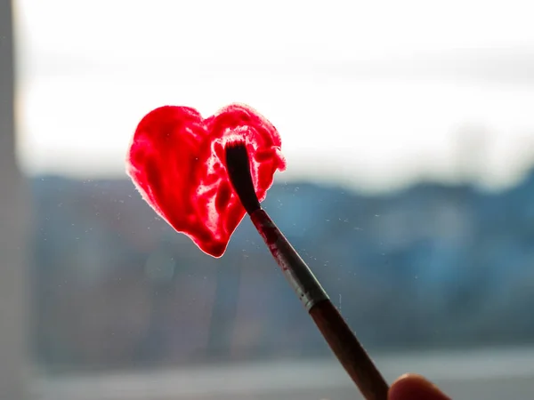 Little Girl Holds Paintbrush Hand Drawing Red Heart Window Glass — Stock Photo, Image