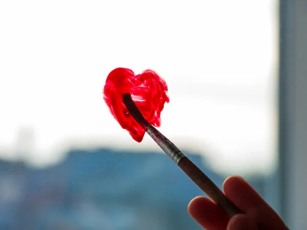 Little Girl Holds Paintbrush Hand Drawing Red Heart Window Glass — Stock Photo, Image