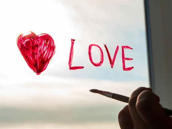 Little Girl Holds Paintbrush Hand Drawing Red Heart Window Glass — Stock Photo, Image