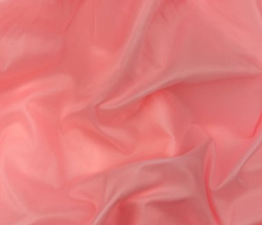 Pembe ipek kumaş üst görünüm. Kırmızı mercan parlak saten arka plan. Moda rengi kadın kıyafetleri modası. Kadın blog blog yazı arkaplanı tasarımı. Kız soyut duvar kağıdı pürüzsüz tekstil yüzeyi.