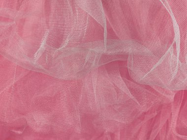 Pembe tül kumaş dokusu üst görünümü. Mercan arka planı. Moda gül rengi modaya uygun kadın etek düz yatak, metin imzası tasarımı için kadın blog parlak arka plan. Kız soyut duvar kağıdı, tekstil yüzeyi