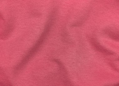 Pembe forma kumaş kumaş desen üst görünümü. Kırmızı mercan örgü saten arka plan. Moda rengi kadın kıyafetleri modası. Kadın blog arka plan metin işareti tasarımı. Kız soyut duvar kağıdı tekstil yüzeyi.