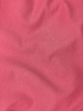 Pembe forma kumaş kumaş desen üst görünümü. Kırmızı mercan örgü saten arka plan. Moda rengi kadın kıyafetleri modası. Kadın blog arka plan metin işareti tasarımı. Kız soyut duvar kağıdı tekstil yüzeyi.