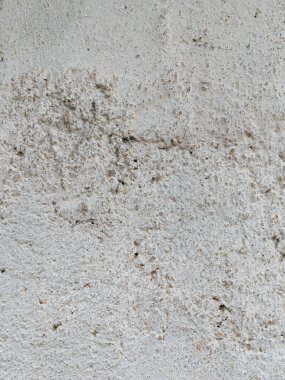 Alçı lambalı gri beton, duvar boyalı tek renkli arka plan. Siyah ve beyaz taş ev kireçtaşı çit dokusu. Metin imzası tasarımı için boşluk kopyala. Mimari detay grunge desenli arkaplan